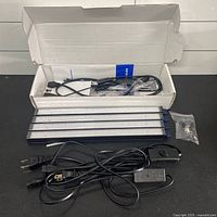 Box contents: four LED bars, cables, hardware