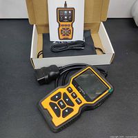 Scanner, manual, USB cable inside open retail box