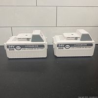 Front view of both 24V batteries showing branding and capacity