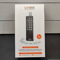 Retail box front showing brand, model FDES113, 4-channel TENS/EMS/Massage unit, 40 intensity indication