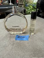 Chanel Chance bottle and Bleu de Chanel travel spray displayed together