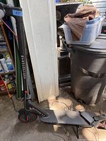 Full view of Gyrocopters Flash 3.0 scooter with charger connected