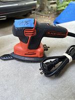 Full view of Black & Decker Mouse corded corner sander with power cord coiled