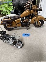 Both motorcycle models side by side for scale