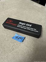 Closed black plastic case showing Sidelines Magic-Stick branding