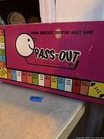 Front of Pass-Out board game box showing title and graphics