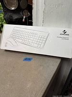 Closed Joyaccess retail box showing outline of keyboard and mouse graphics