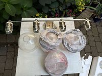 Fixture with three intact globes and mounting hardware