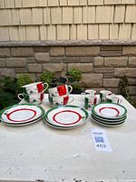 Full set of cups and saucers displayed on table