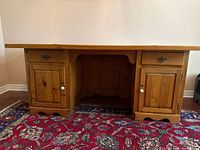 Front view of pine pedestal desk showing overall design