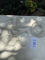 Five clear ribbed Manhattan inserts on table