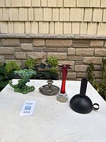 All four candlesticks grouped on surface