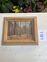 Front view of framed woodland oil painting