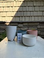 all four ceramic planters grouped together