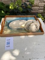 Wooden tray and ceramic sea urchin together