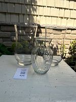 Front view showing all three clear vases