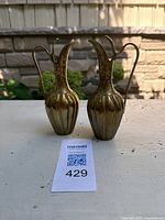 Front view showing both brass carafes