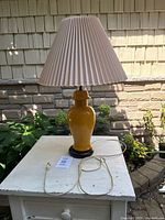 Full view of lamp on table, cord visible