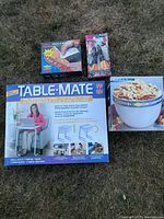 All four boxed items laid out on lawn