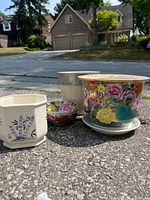 Group shot of four planters showing designs and relative sizes