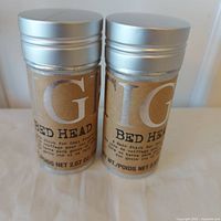 Front view of two TIGI Bed Head Hair Sticks showing labels and size