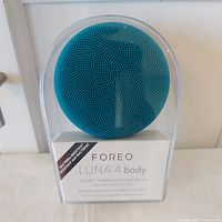 Front view of sealed Foreo Luna 4 Body T-Sonic Massaging Body Brush package