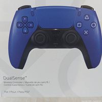 Front of sealed retail box showing cobalt blue DualSense controller image and PlayStation branding