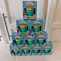 Stack of ten boxed Gabby’s Dollhouse Surprise Figures