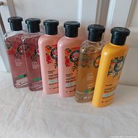 Six Herbal Essences bottles standing in two groups of three