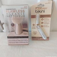 Front view of both sealed Finishing Touch devices