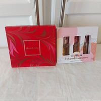 Front view of Elizabeth Arden and Solinotes gift set boxes