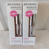 Front view showing both boxed Jouviance Restructiv Plump FX serums