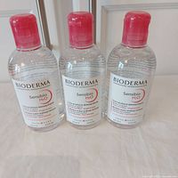 Three sealed 250 ml Bioderma Sensibio H2O bottles standing upright