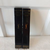 Front view of two boxed YSL Lash Clash mascaras