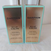 Front view of both sealed Darphin Éclat Sublime boxes