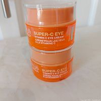 Two stacked StriVectin Super-C eye cream jars front label visible