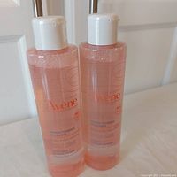 Front view of two sealed 200 ml Avene Soothing Toning Lotion bottles