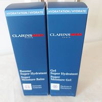 Front view of both boxed Clarins Men products