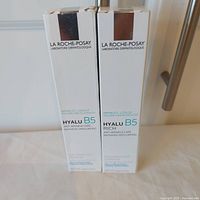 Front view of both boxed Hyalu B5 products