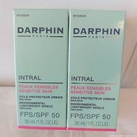 Front view of two sealed Darphin Intral SPF 50 boxes