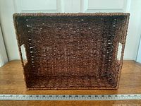 Basket interior showing weave and handle cut-outs