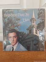 Front view of Elvis Presley How Great Thou Art LP in shrink sleeve