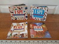 Group shot of four I Spy toddler books showing titles and scale ruler