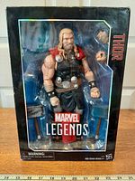 Front view of boxed Thor figure showing figure and accessories