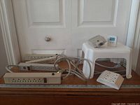 All items together: three power strips, stool, adapters