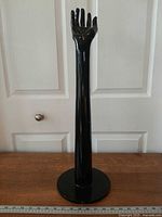 Full view of mannequin hand on base front