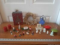 Full lot overview on tabletop showing all decor pieces, candles and ornaments