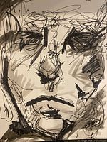 Close-up of facial detail and signature