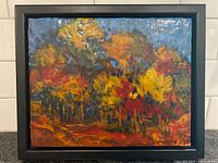 Front view of framed encaustic painting showing autumn landscape
