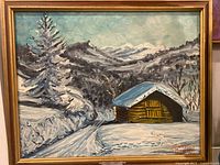 Full view of framed painting showing entire winter scene with cabin and mountains